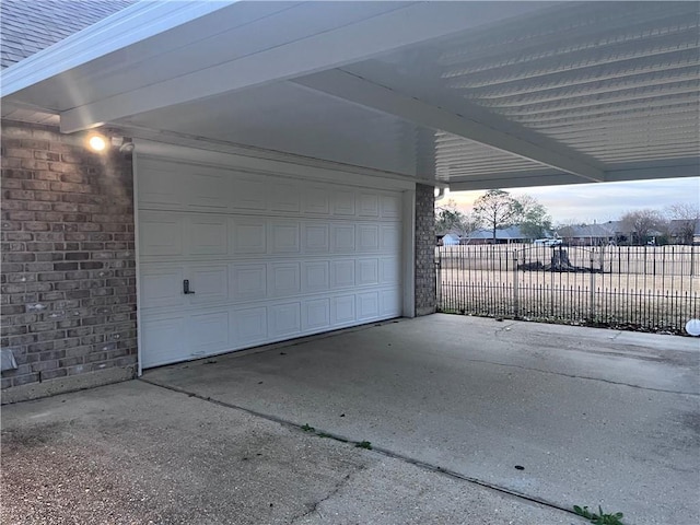 2261 Country Club Dr, La Place, LA 70068 - garage featuring a carport and fence