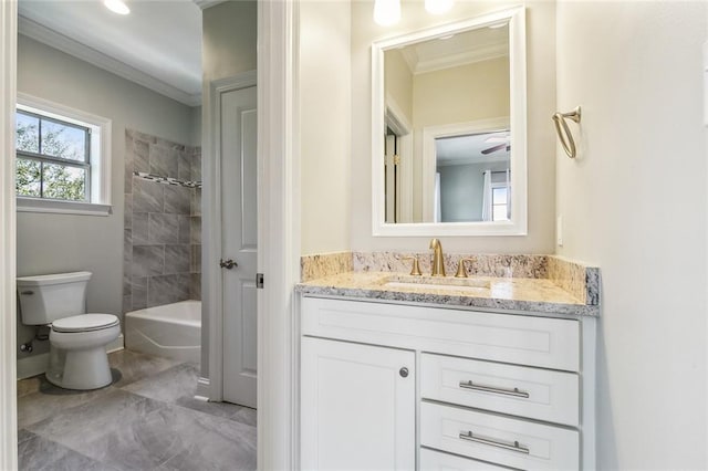 full bathroom featuring crown molding, tiled shower / bath, vanity, and toilet