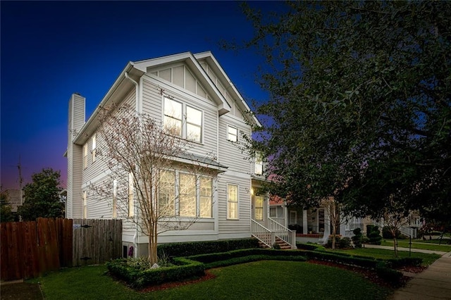 view of front of house with a lawn