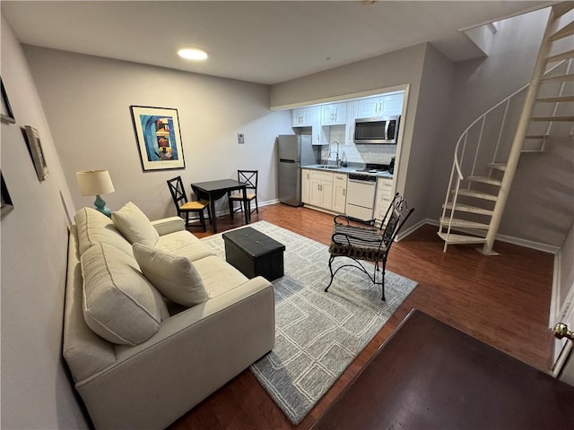 1119 Dauphine St Unit 11, New Orleans, LA 70116 - living area featuring stairway, baseboards, recessed lighting, and wood finished floors