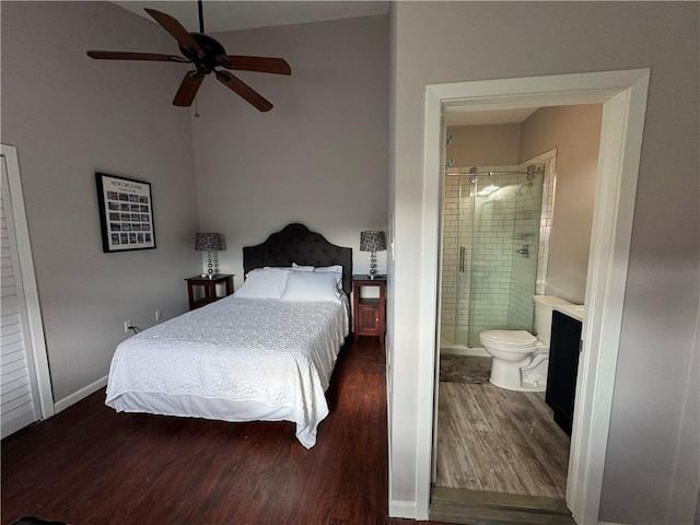 bedroom with ceiling fan, ensuite bath, and dark hardwood / wood-style floors