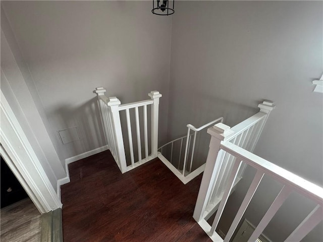 stairs featuring hardwood / wood-style flooring