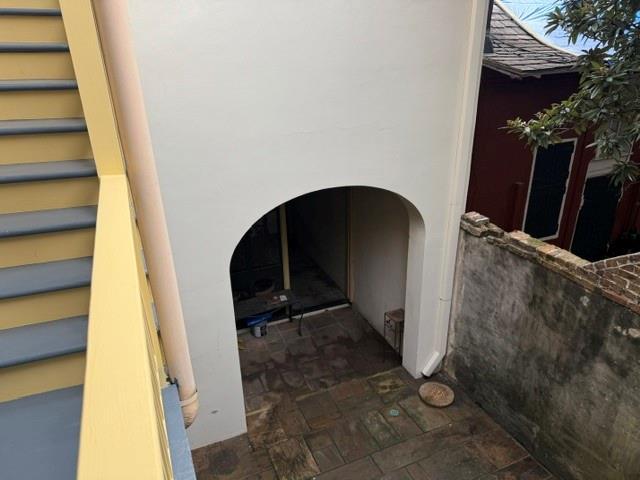 1119 Dauphine St Unit 11, New Orleans, LA 70116 - detailed view of arched walkways and stucco siding