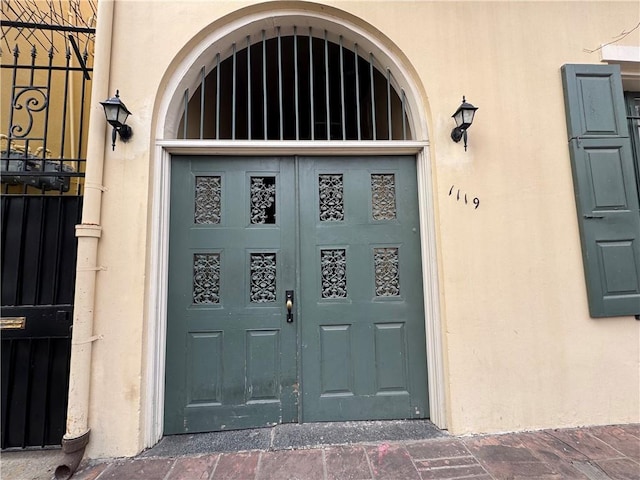 1119 Dauphine St Unit 11, New Orleans, LA 70116 - property entrance featuring stucco siding