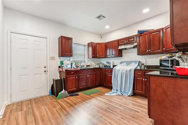 kitchen featuring sink and light wood-type flooring