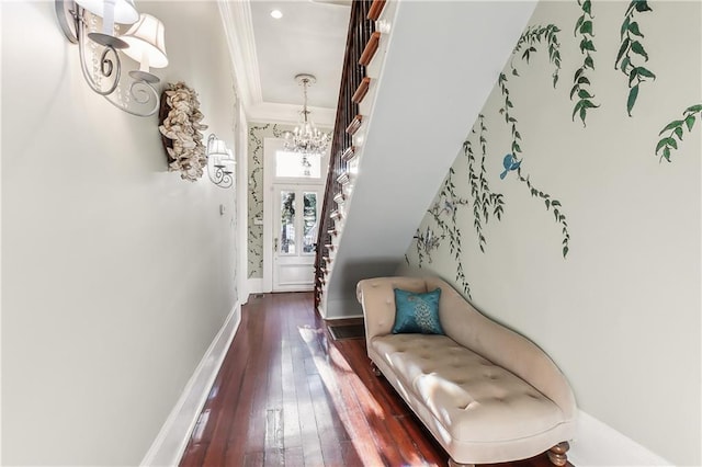 interior space with ornamental molding, dark hardwood / wood-style floors, and a chandelier