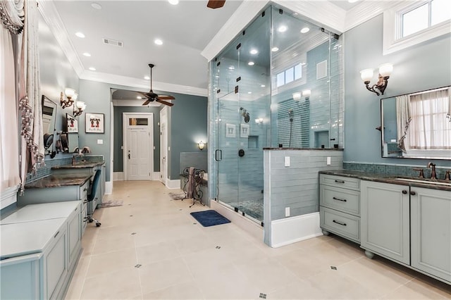 bathroom with ceiling fan, vanity, tile patterned flooring, and a shower with door