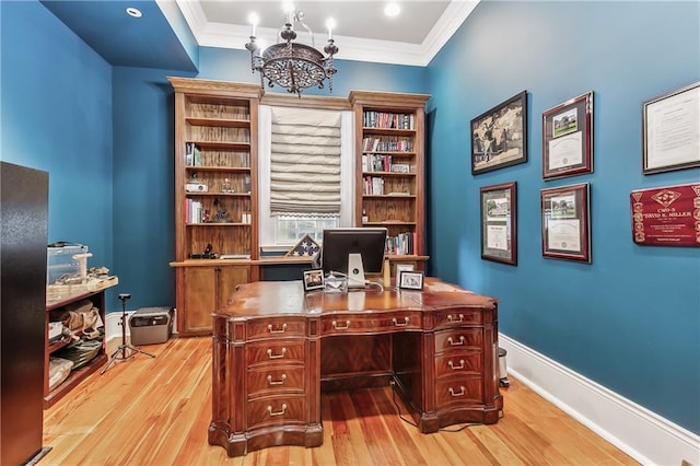 home office featuring ornamental molding, a chandelier, and light wood-type flooring