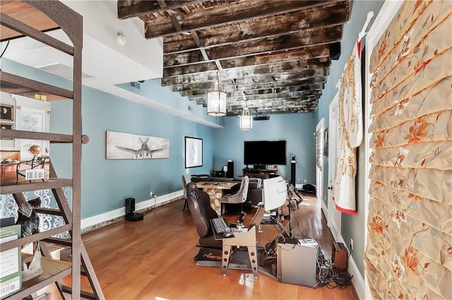 office space with hardwood / wood-style floors and beamed ceiling