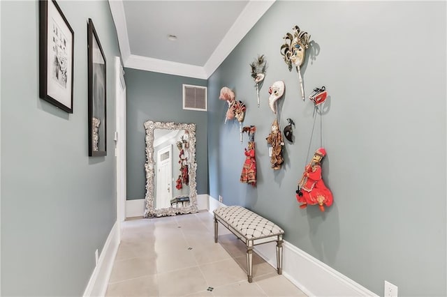 corridor with ornamental molding and light tile patterned floors