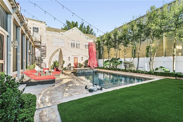 view of swimming pool with a patio and a lawn