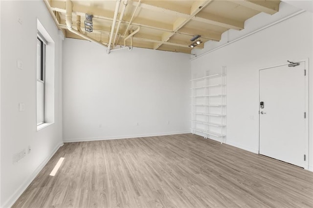 835 Julia St Unit 18, New Orleans, LA 70113 - empty room featuring wood finished floors and baseboards