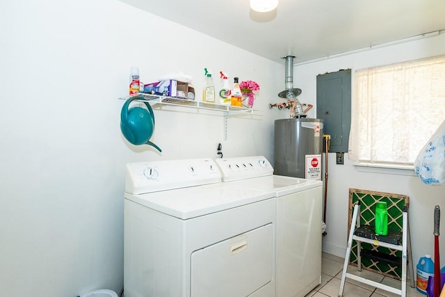 clothes washing area featuring light tile patterned floors, washing machine and dryer, water heater, and electric panel