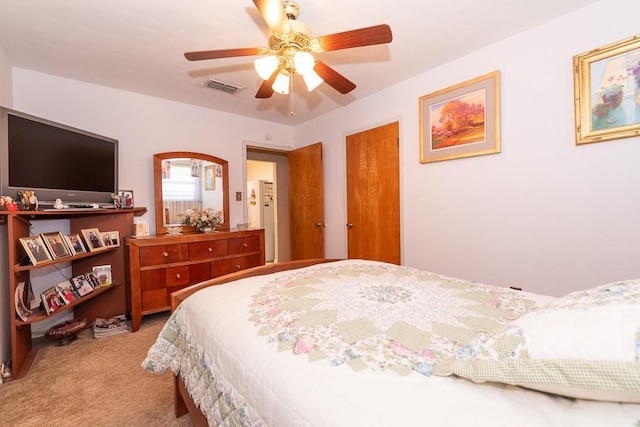 carpeted bedroom featuring ceiling fan