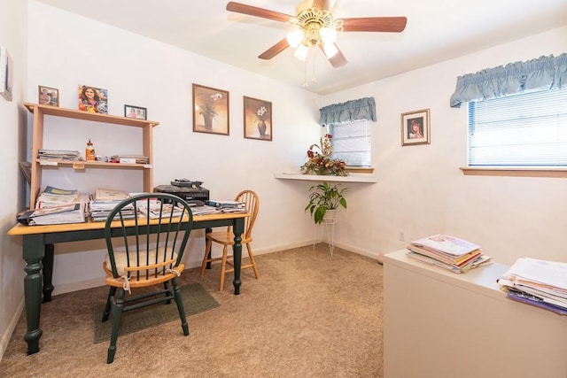 carpeted office with ceiling fan