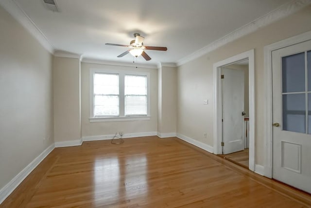 spare room featuring ornamental molding, ceiling fan, and light hardwood / wood-style floors