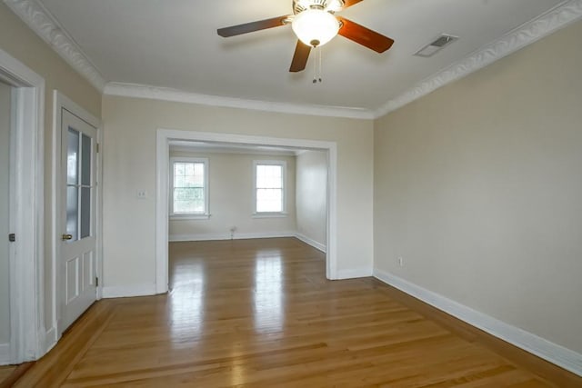 unfurnished room featuring crown molding, ceiling fan, and hardwood / wood-style floors