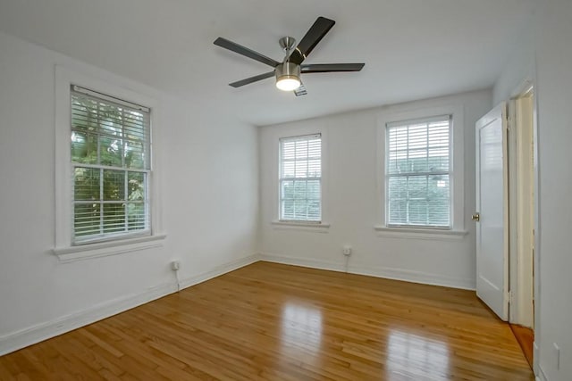 spare room featuring ceiling fan and light wood-type flooring