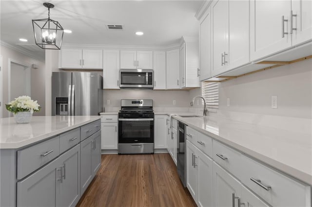 kitchen featuring gray cabinets, appliances with stainless steel finishes, white cabinetry, sink, and dark hardwood / wood-style flooring