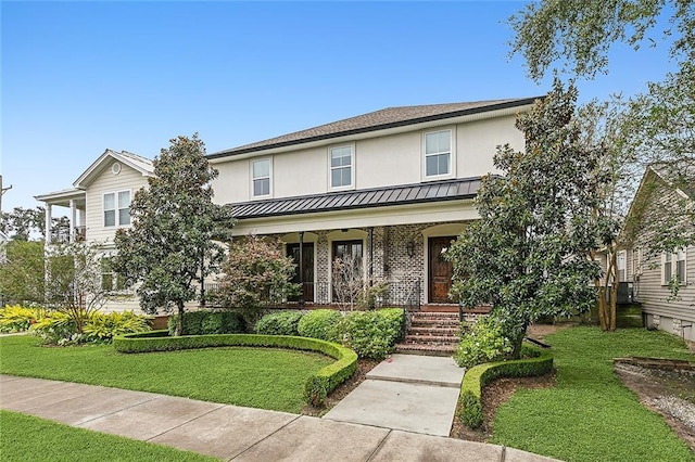 view of front of house featuring a porch and a front lawn