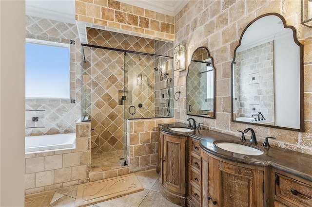 bathroom with tile patterned floors, ornamental molding, separate shower and tub, and vanity