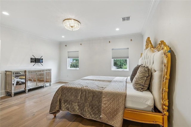 bedroom featuring hardwood / wood-style flooring and ornamental molding