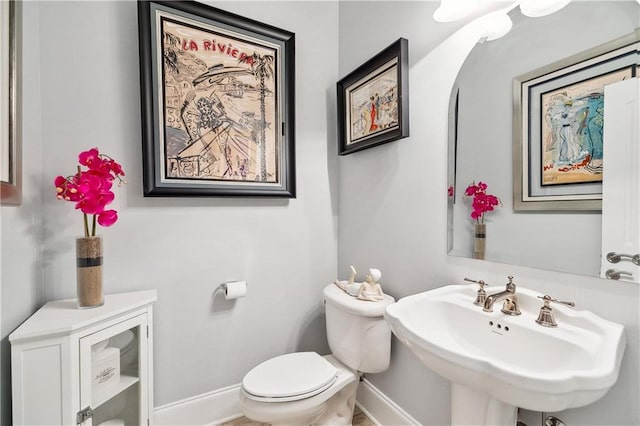 bathroom with sink and toilet