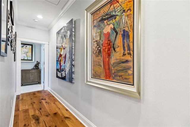 hall featuring hardwood / wood-style flooring and ornamental molding