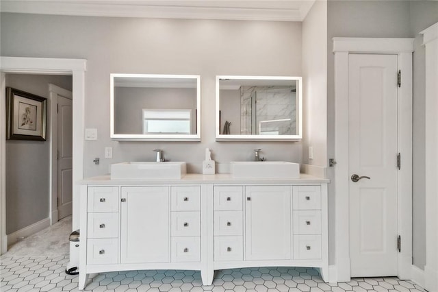 bathroom with crown molding and vanity