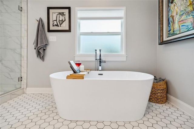 bathroom featuring tile patterned floors and separate shower and tub