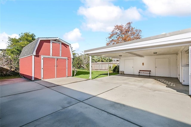 exterior space featuring a carport and a lawn