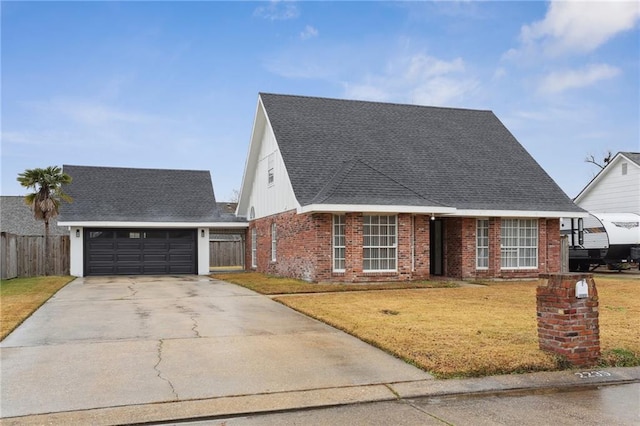 view of front facade featuring a garage and a front lawn