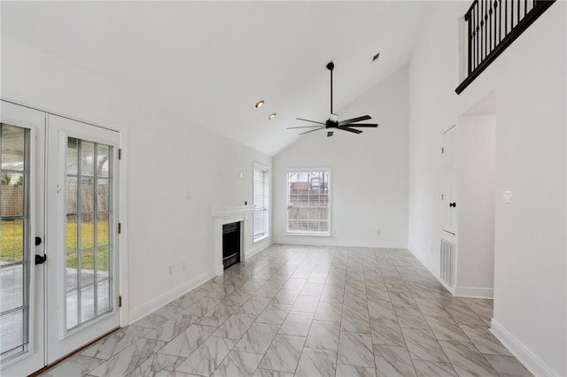 unfurnished living room featuring french doors, ceiling fan, and vaulted ceiling