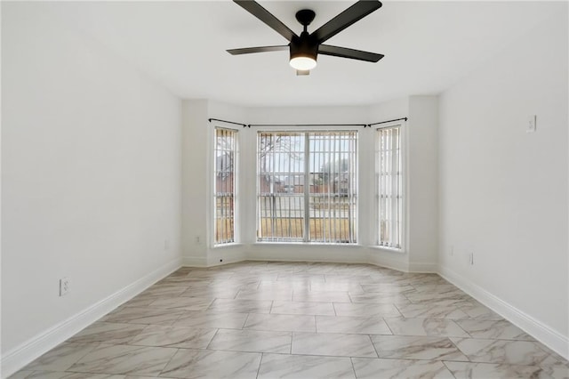 unfurnished room with ceiling fan