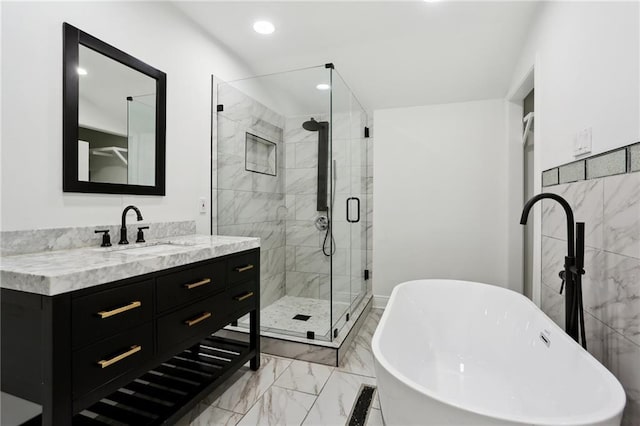 bathroom with vanity and separate shower and tub