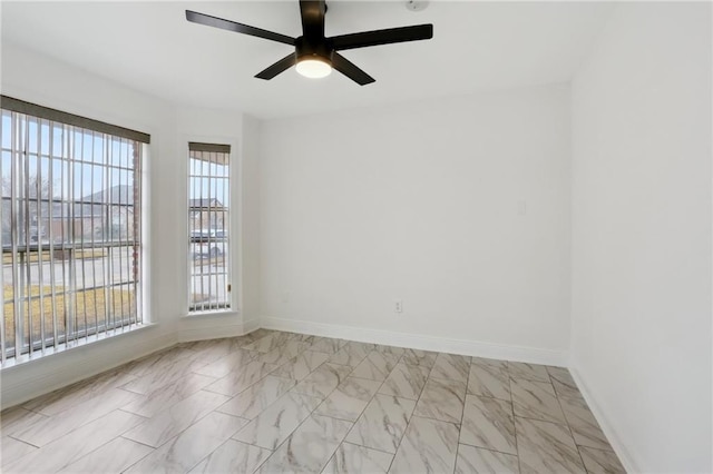 unfurnished room with ceiling fan