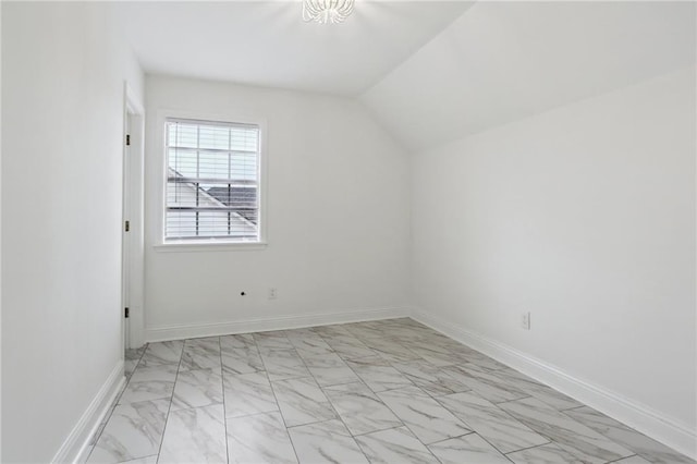 additional living space featuring lofted ceiling