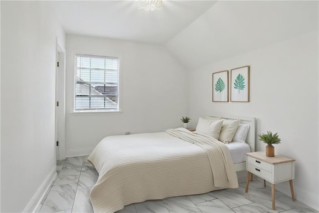 bedroom with lofted ceiling