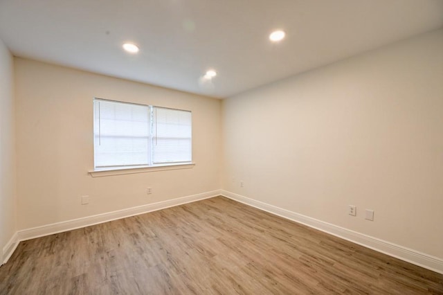 spare room featuring hardwood / wood-style floors