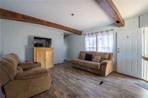 living room featuring beamed ceiling and wood-type flooring