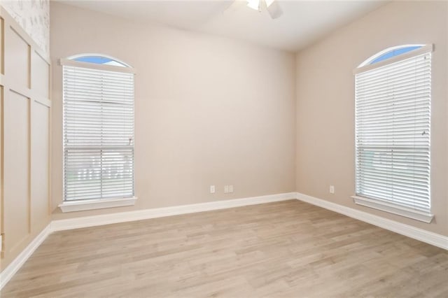 spare room with ceiling fan and light hardwood / wood-style flooring