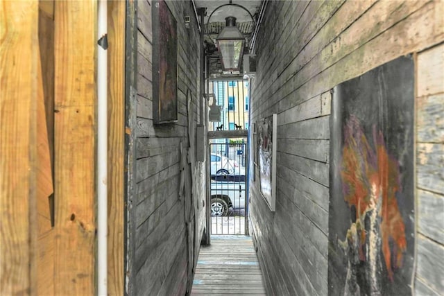 corridor with light hardwood / wood-style floors