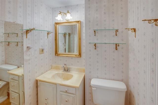 bathroom featuring vanity and toilet