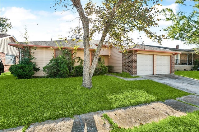 ranch-style home featuring a garage and a front yard