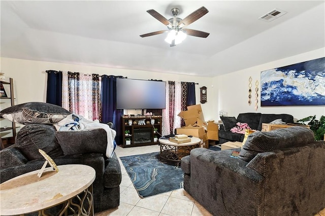 living room with light tile patterned floors and ceiling fan