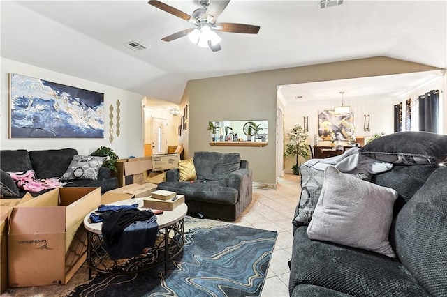 tiled living room featuring lofted ceiling and ceiling fan