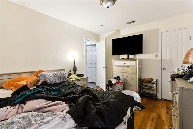 bedroom featuring dark wood-type flooring