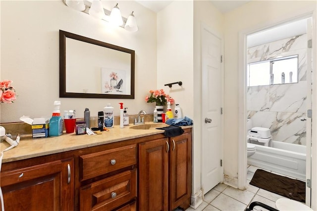 full bathroom with tiled shower / bath, tile patterned floors, toilet, and vanity