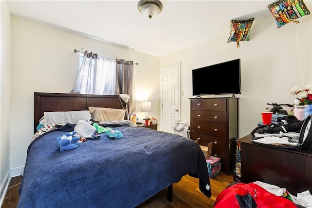 bedroom featuring dark wood-type flooring