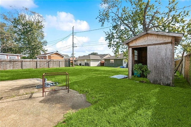 view of yard with a patio area and a shed